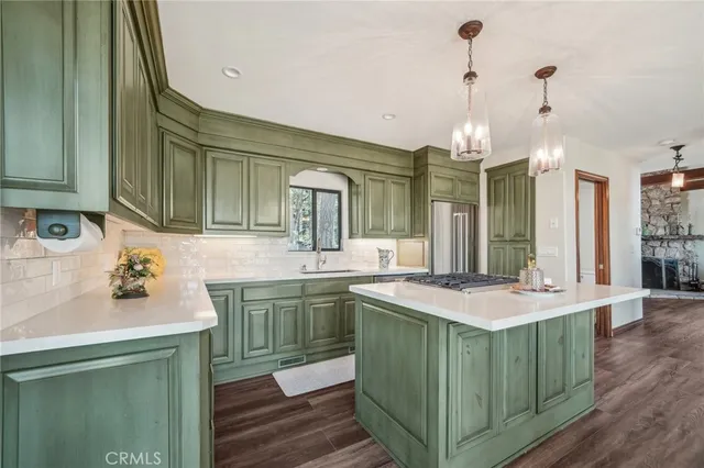 a kitchen with a sink and cabinets