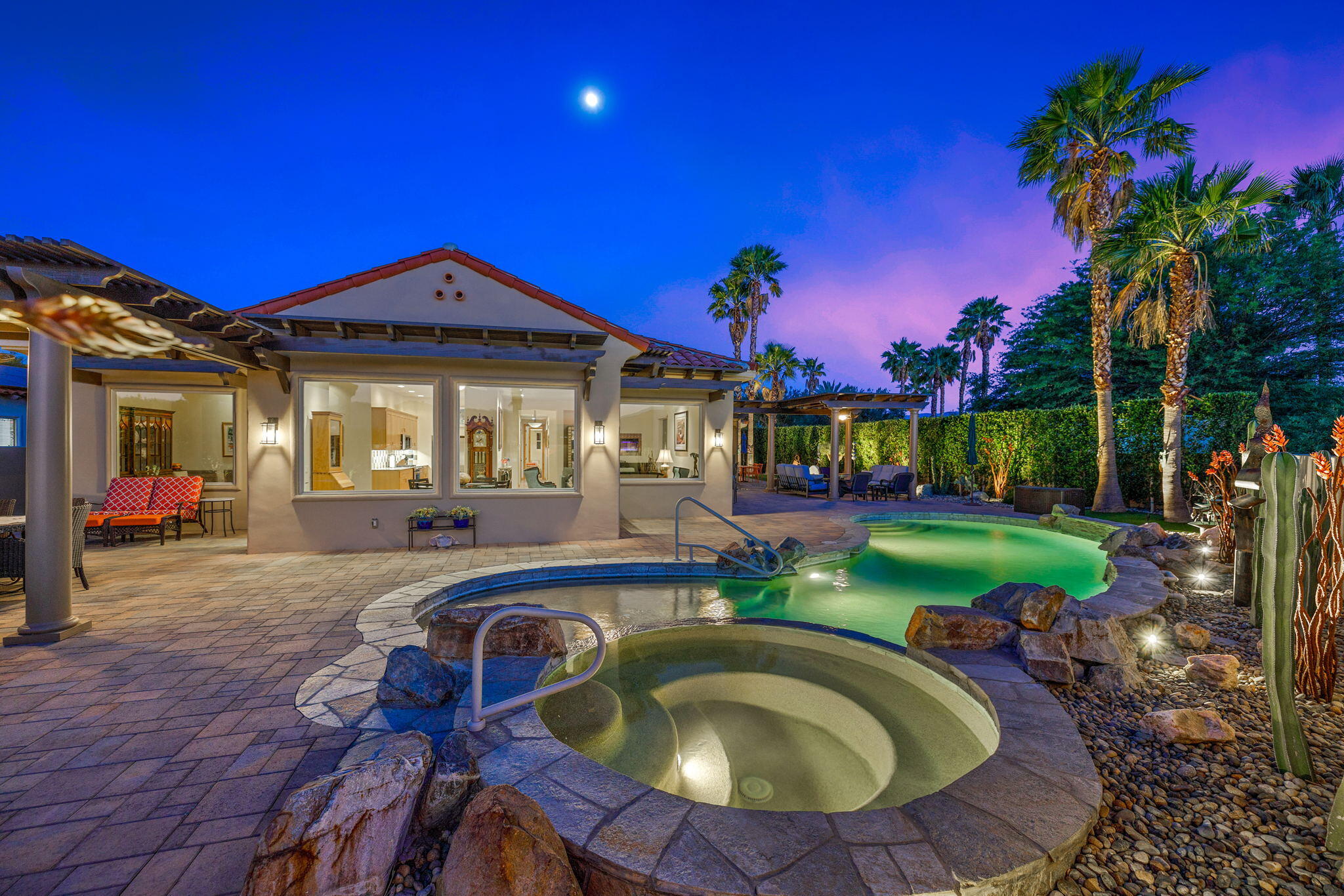 331 Loch Lomond Road Rancho Mirage, CA 92270 - Photo 4 of 37 a view of a house with backyard swimming pool and sitting area