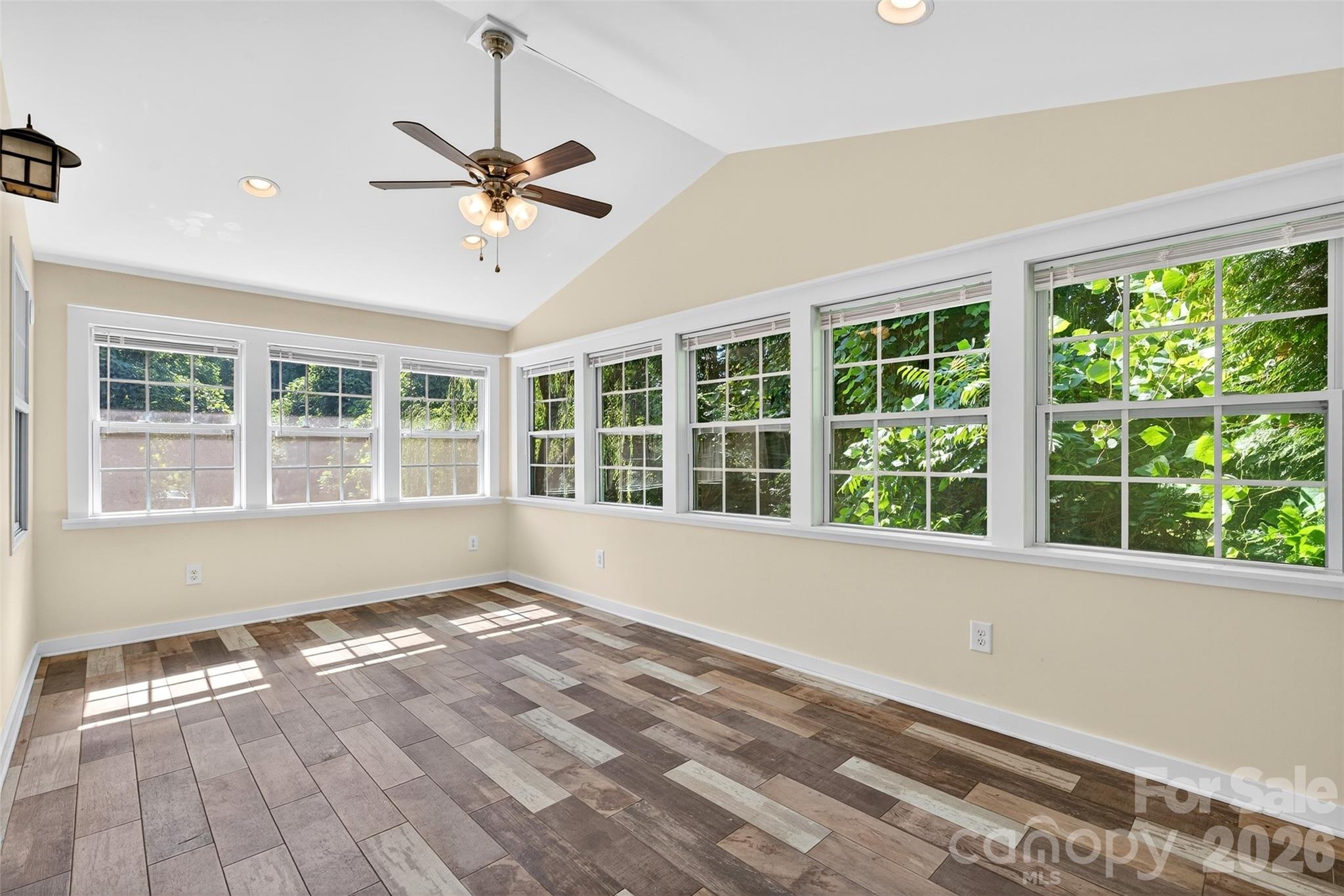 160 East Howard Street Tryon, NC 28782 - Photo 34 of 48 a view of empty room with wooden floor and fan