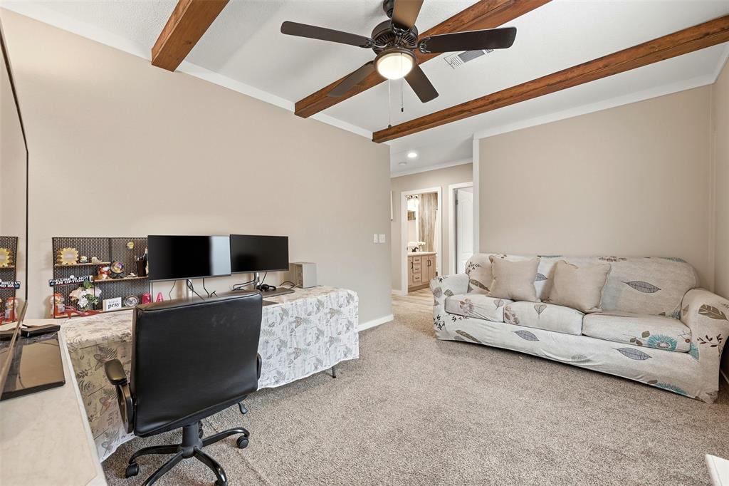 2114 Hickory Street Mabank, TX 75156 - Photo 19 of 31 Bonus room with ceiling fan, beamed ceiling, and feature wall with decorative lighting. Gret for an office, gameroom or 4th bedroom!