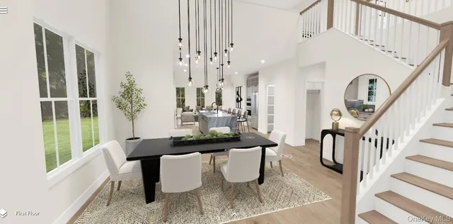 a living room with fireplace furniture and a large window