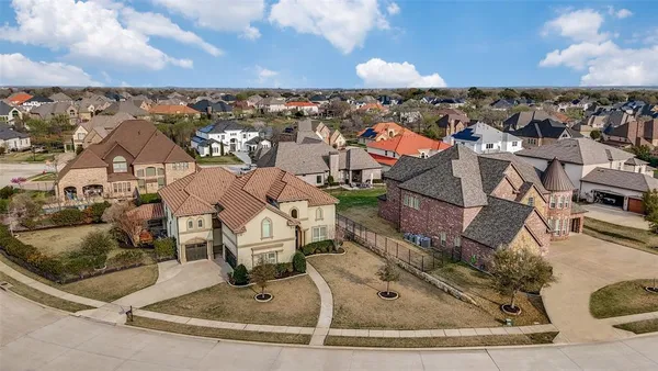 an aerial view of a house with a swimming pool