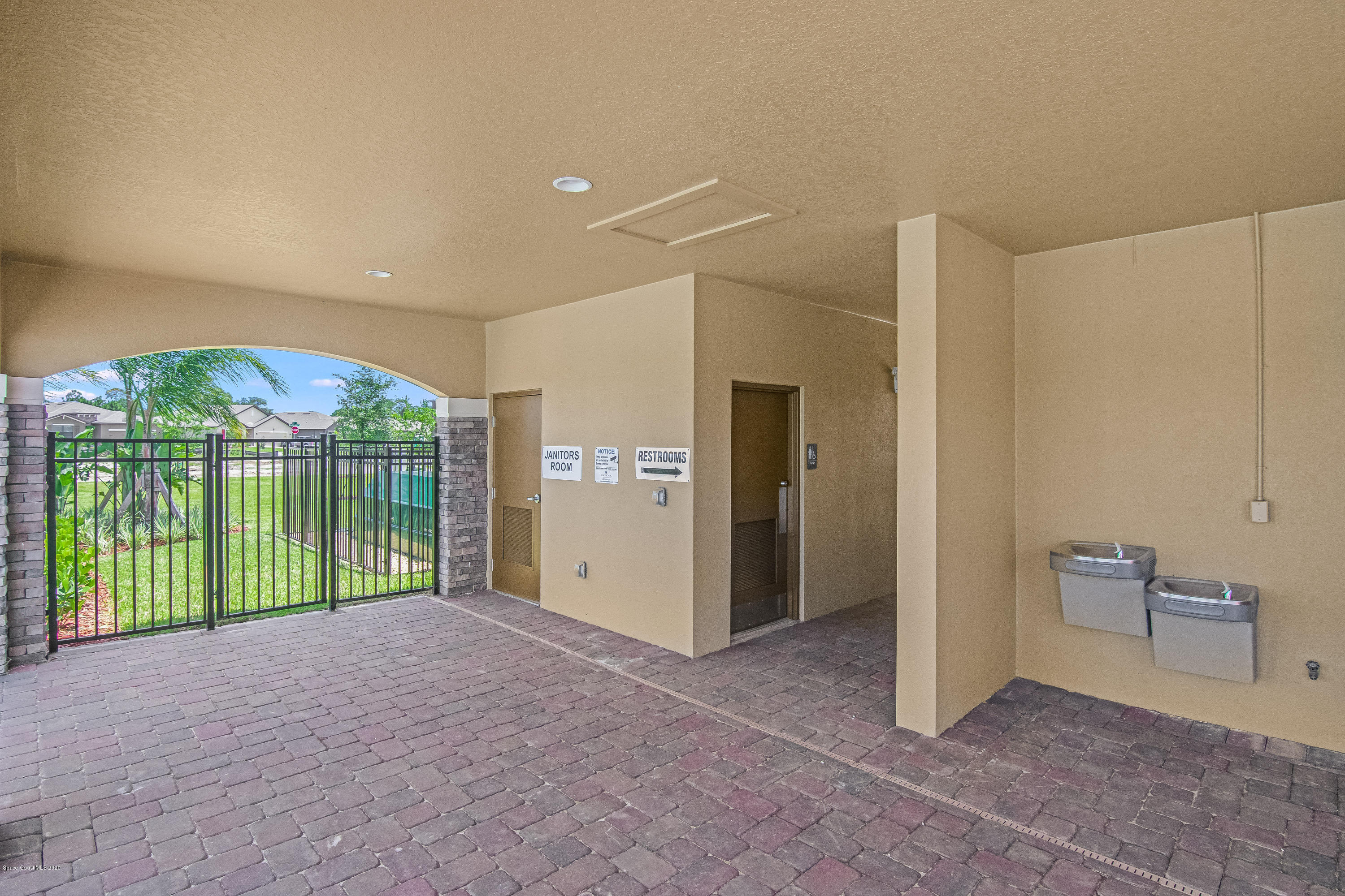 578 Old Country Rd S East Palm Bay, FL 32909 - Photo 24 of 26 a view of a big room with a large window and front door