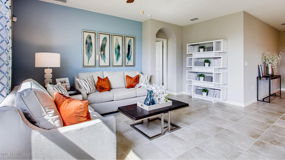 578 Old Country Rd S East Palm Bay, FL 32909 - Photo 6 of 26 a living room with furniture a rug and a window