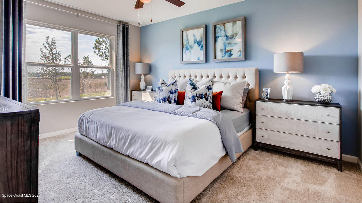 578 Old Country Rd S East Palm Bay, FL 32909 - Photo 7 of 26 a bedroom with bed and a window