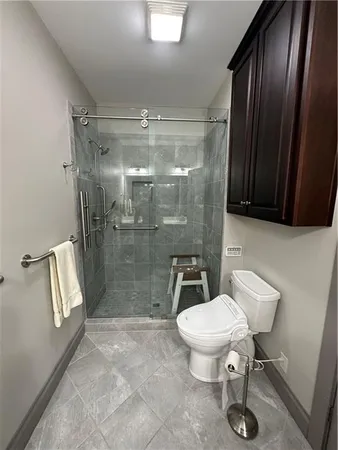 a kitchen with granite countertop a sink stainless steel appliances and cabinets