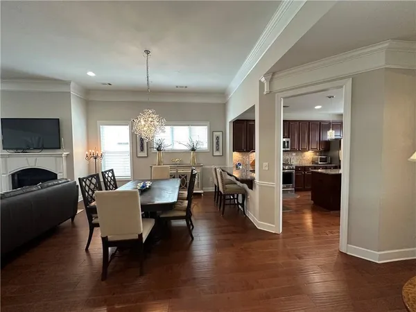 a living room with furniture fireplace and flat screen tv