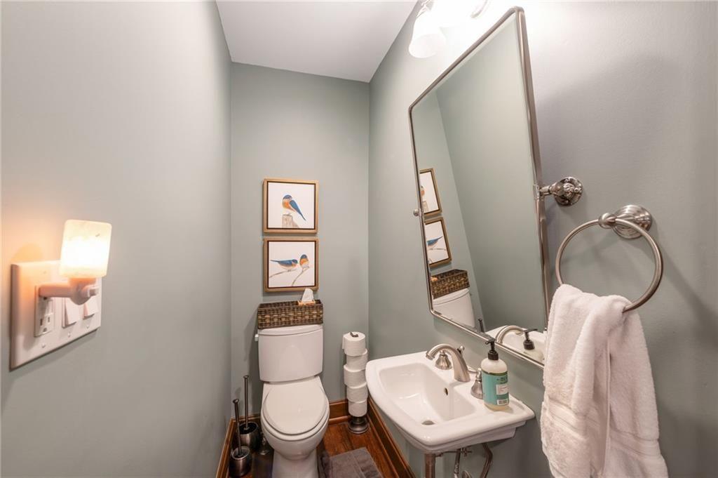 1810 East Clifton Road Northeast Atlanta, GA 30307 - Photo 14 of 50 a bathroom with a toilet a sink and mirror