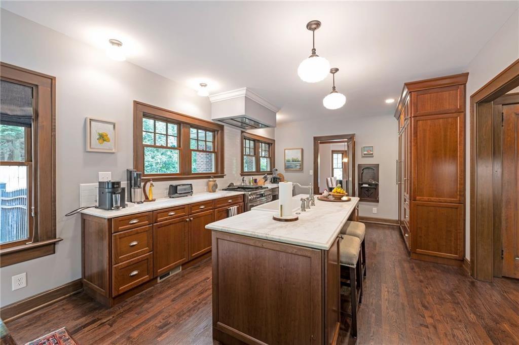 1810 East Clifton Road Northeast Atlanta, GA 30307 - Photo 15 of 50 a kitchen with sink refrigerator and window