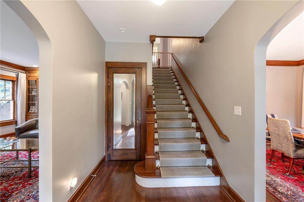 1810 East Clifton Road Northeast Atlanta, GA 30307 - Photo 3 of 50 a view of entryway with wooden floor and stairs