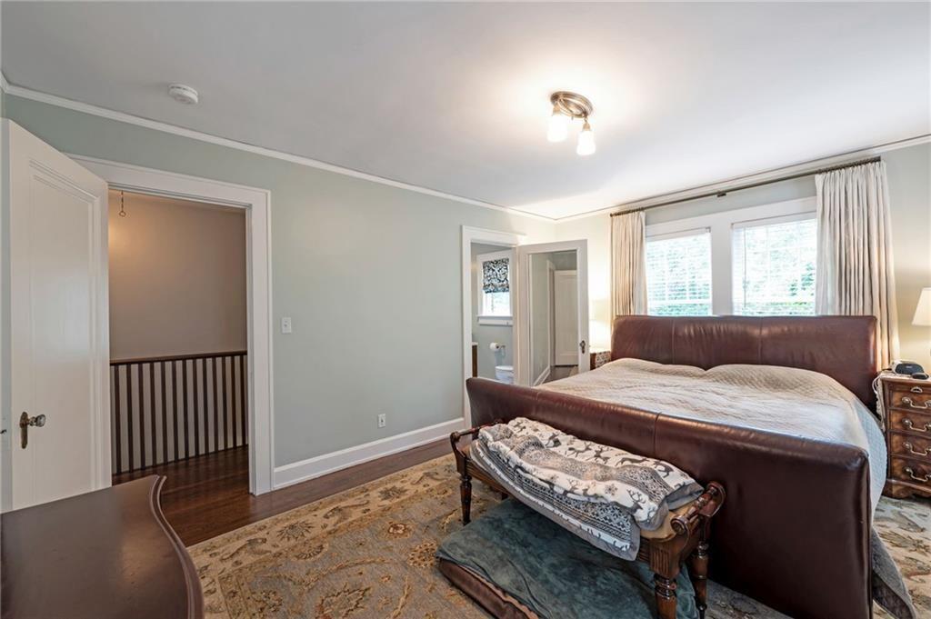 1810 East Clifton Road Northeast Atlanta, GA 30307 - Photo 31 of 50 a bedroom with a bed and a table in it