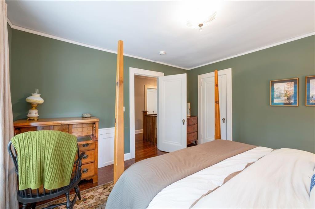 1810 East Clifton Road Northeast Atlanta, GA 30307 - Photo 34 of 50 a bedroom with a bed and a mirror