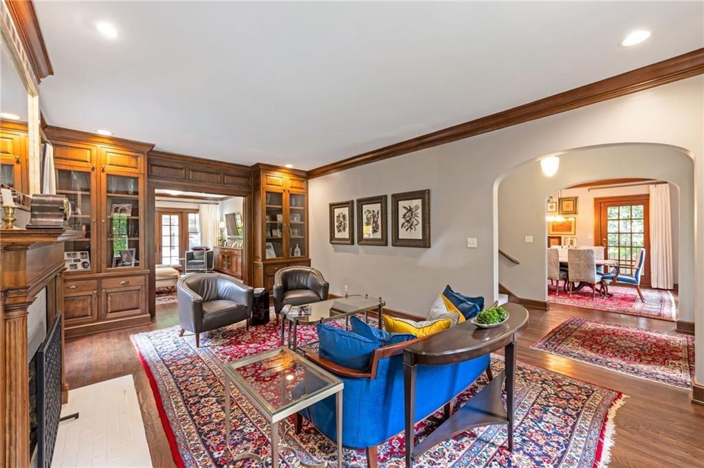 1810 East Clifton Road Northeast Atlanta, GA 30307 - Photo 5 of 50 a living room with furniture a rug and a floor to ceiling window