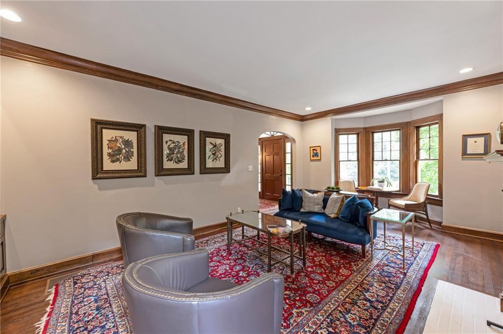 1810 East Clifton Road Northeast Atlanta, GA 30307 - Photo 6 of 50 a living room with furniture and a potted plant