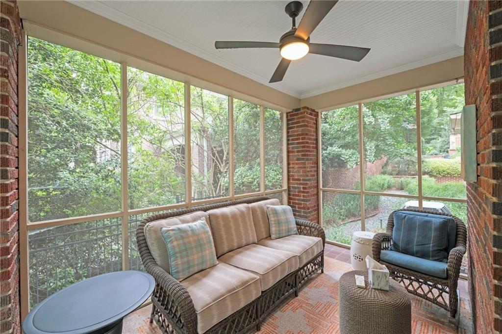 1810 East Clifton Road Northeast Atlanta, GA 30307 - Photo 8 of 50 a living room with furniture and a floor to ceiling window