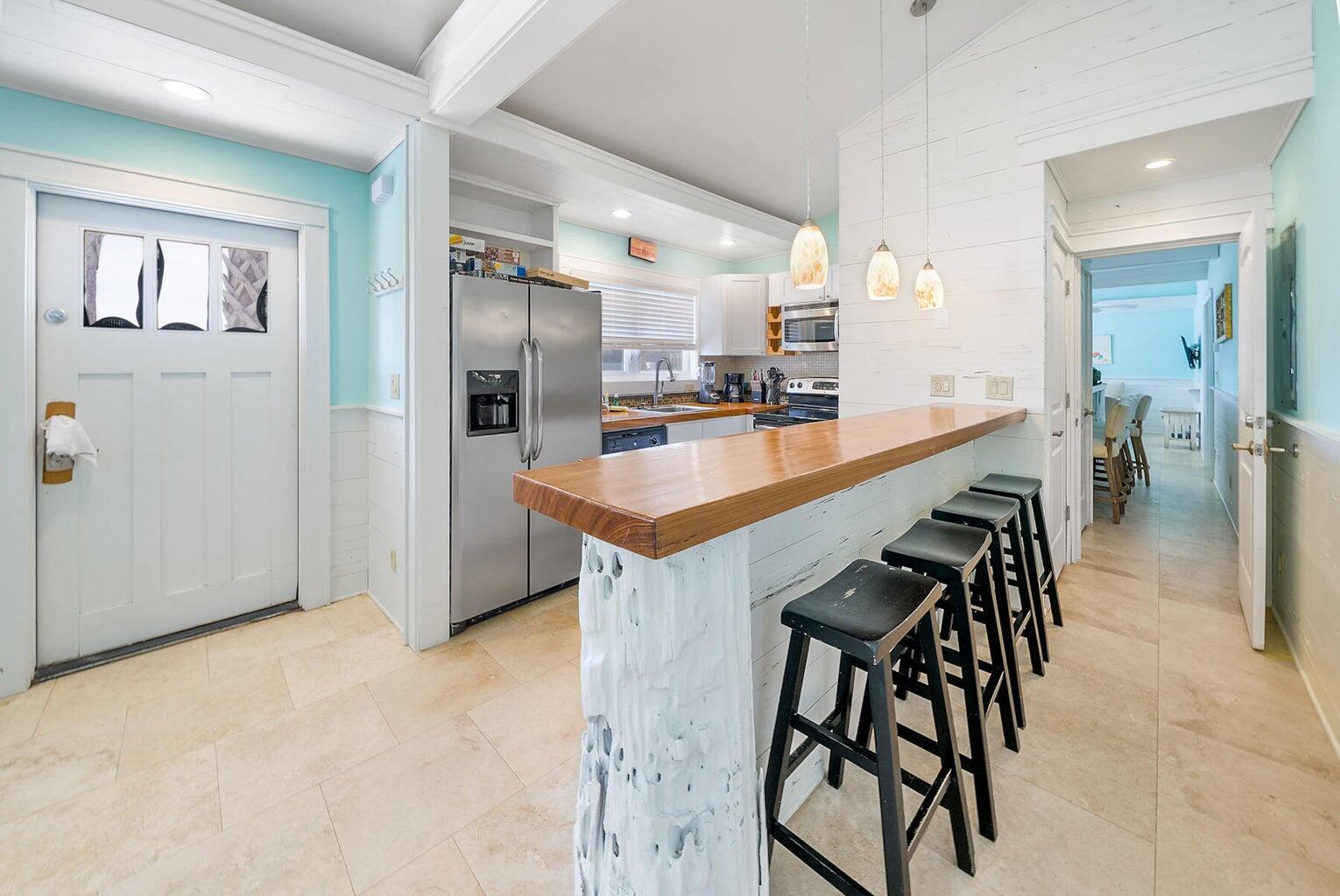 36 Green Street Inlet Beach, FL 32461 - Photo 19 of 29 a kitchen with stainless steel appliances kitchen island a table and chairs in it