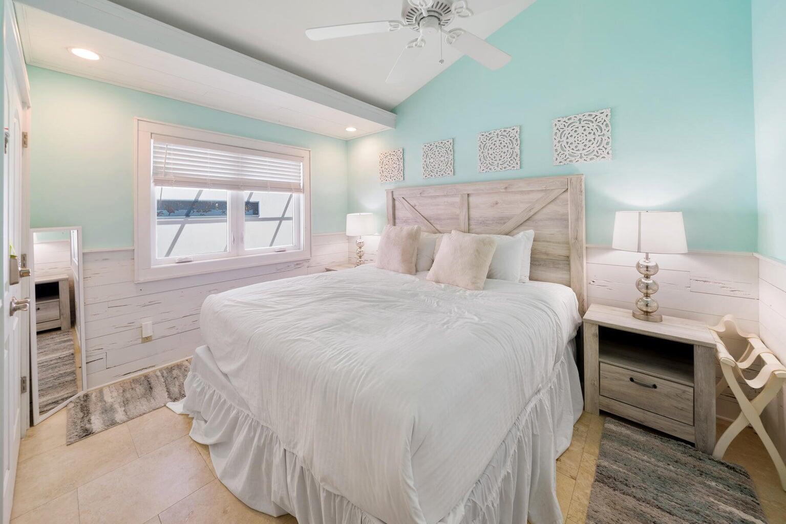 36 Green Street Inlet Beach, FL 32461 - Photo 6 of 29 a bedroom with a bed and a chandelier