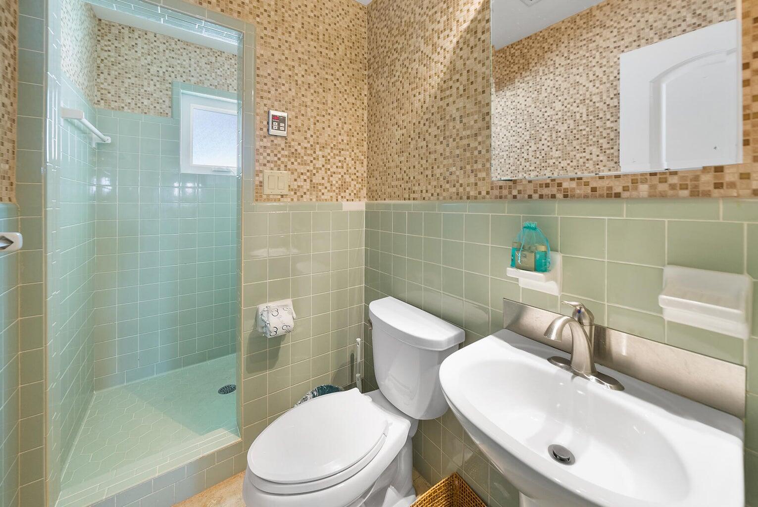 36 Green Street Inlet Beach, FL 32461 - Photo 8 of 29 a white toilet sitting next to a bathroom sink