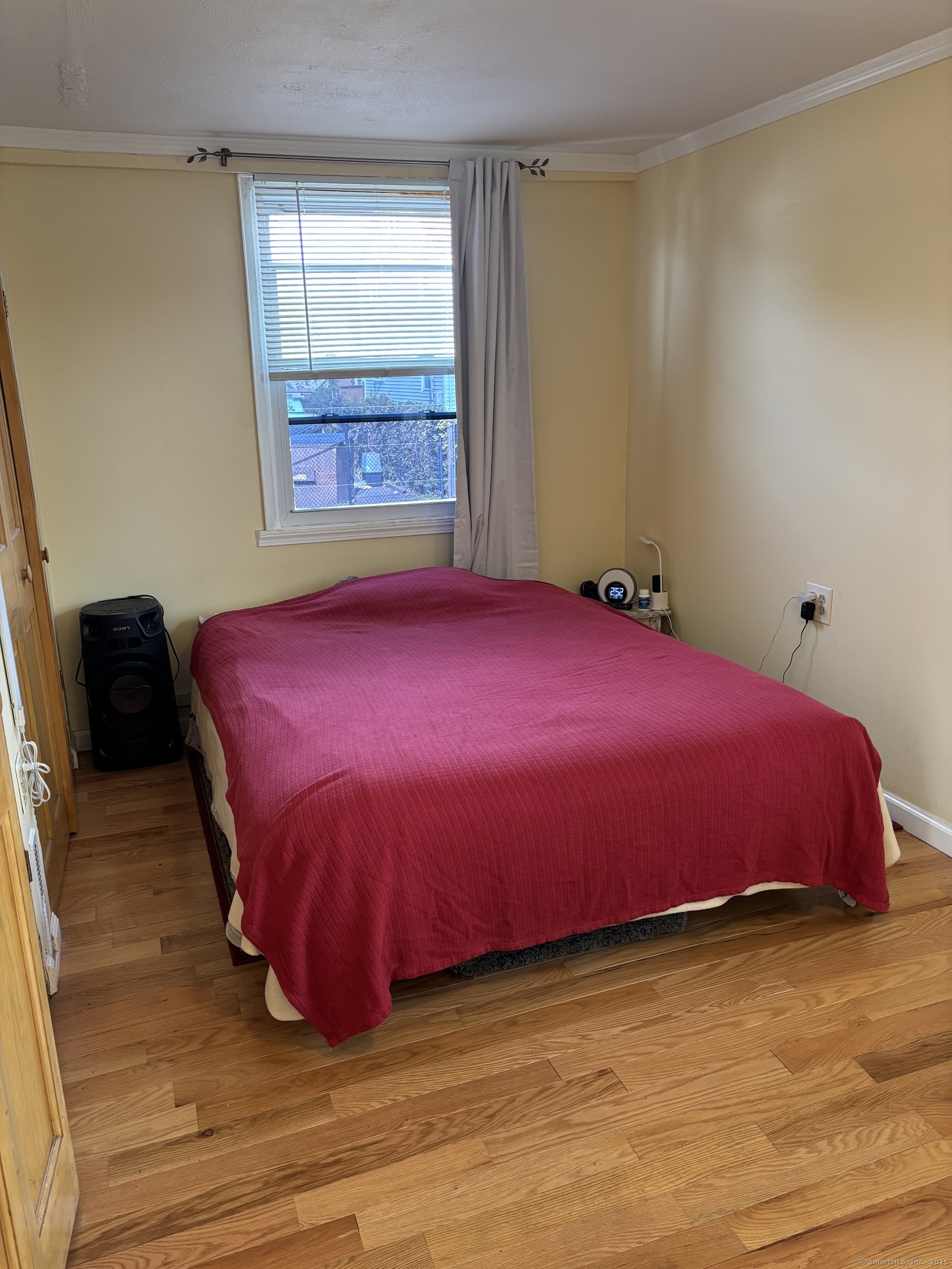 15 Harding Avenue Stratford, CT 06615 - Photo 12 of 38 a bedroom with a bed and a window