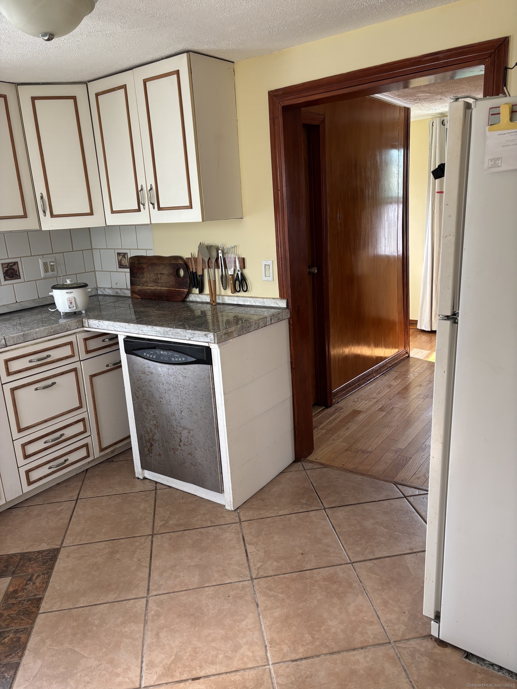 15 Harding Avenue Stratford, CT 06615 - Photo 13 of 38 a kitchen with a stove a refrigerator and a sink