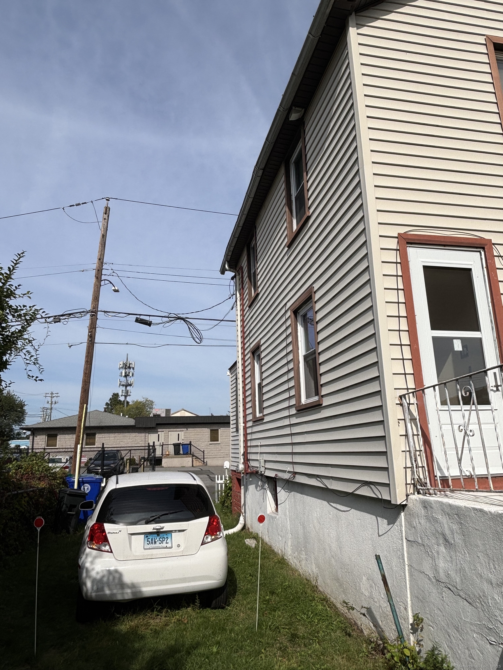 15 Harding Avenue Stratford, CT 06615 - Photo 17 of 38 a white car parked in front of a house