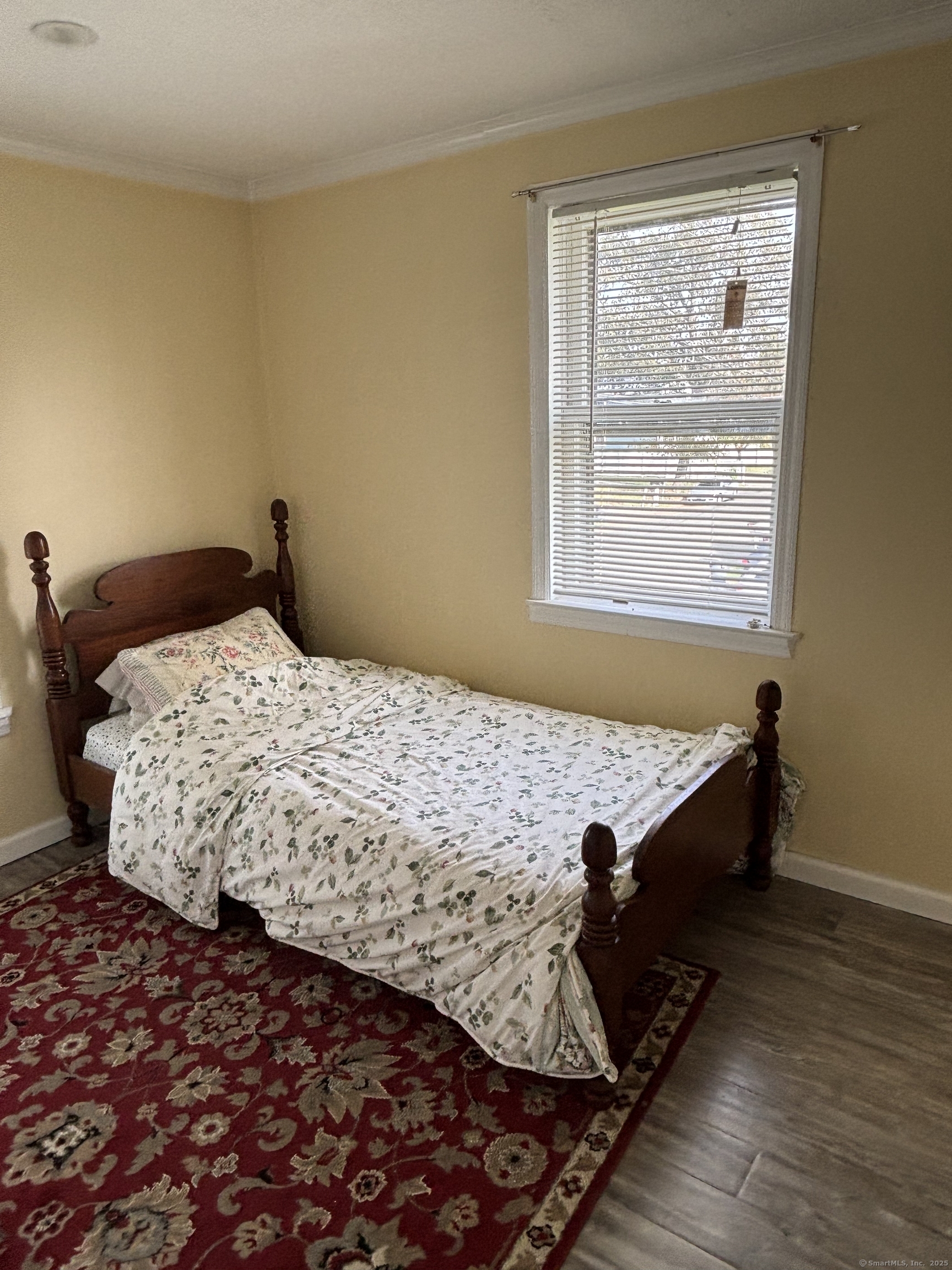 15 Harding Avenue Stratford, CT 06615 - Photo 25 of 38 a bed sitting in a bedroom next to a window