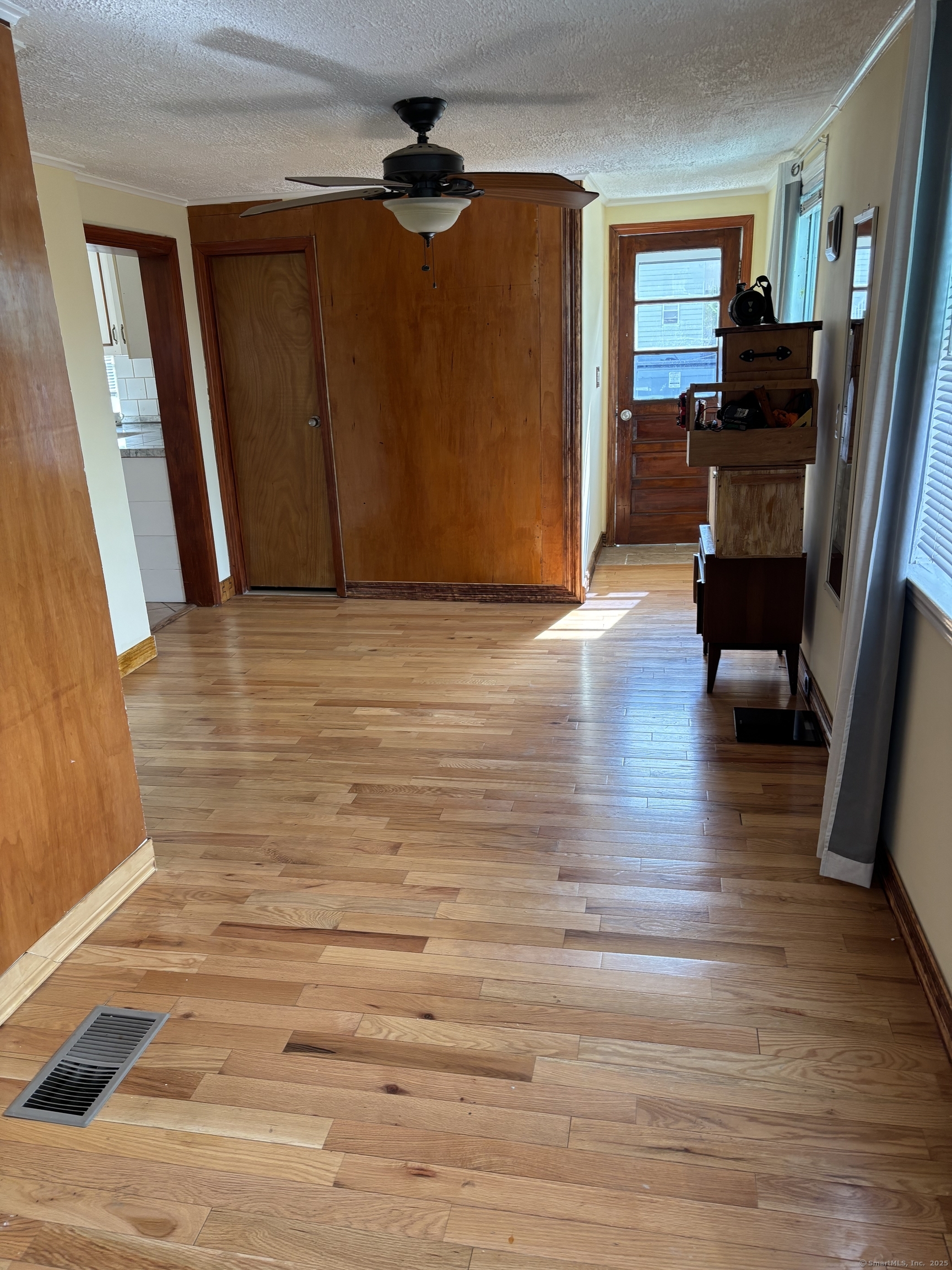 15 Harding Avenue Stratford, CT 06615 - Photo 27 of 38 a view of empty room with wooden floor and fan