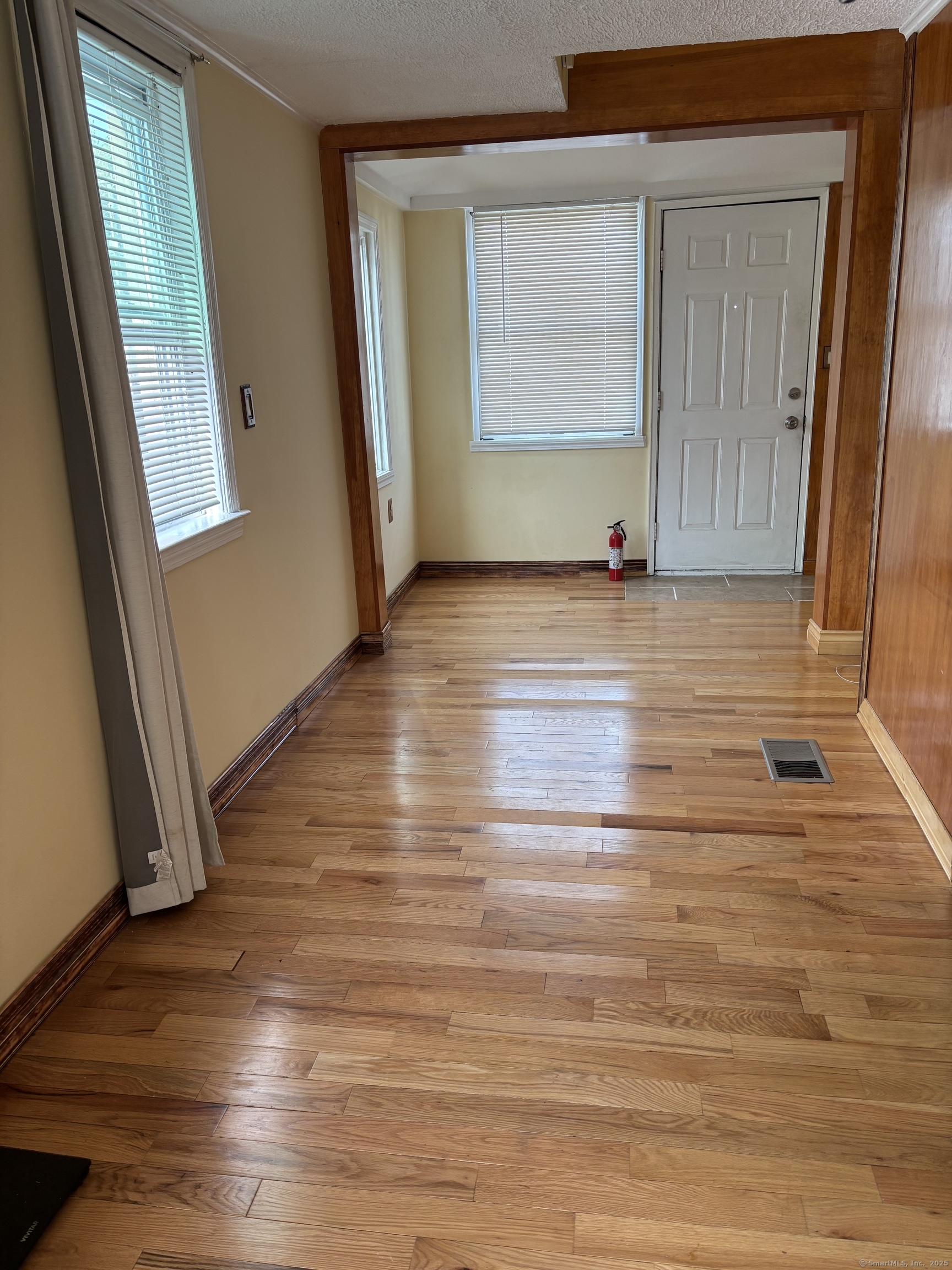 15 Harding Avenue Stratford, CT 06615 - Photo 28 of 38 a view of empty room with window and wooden floor