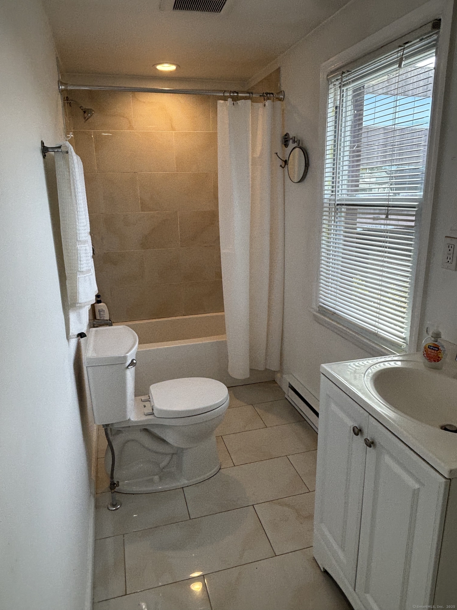 15 Harding Avenue Stratford, CT 06615 - Photo 28 of 38 a bathroom with a sink a toilet and shower