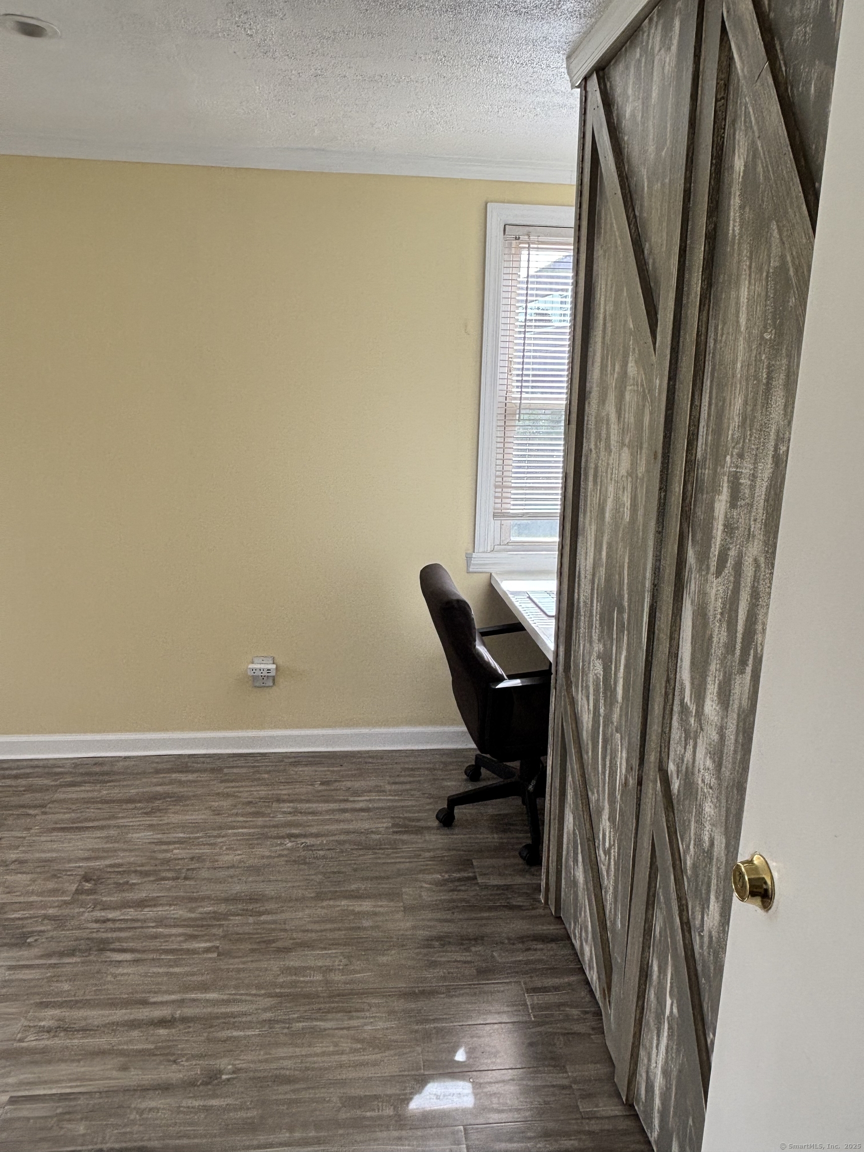 15 Harding Avenue Stratford, CT 06615 - Photo 31 of 38 a view of a room with wooden floor and chair