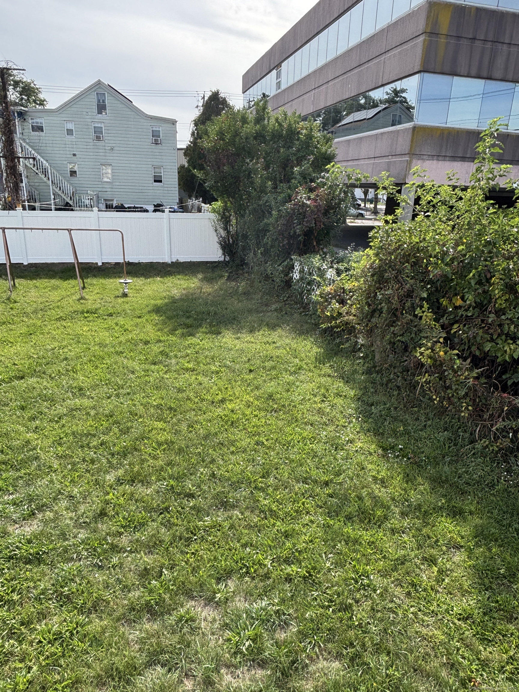 15 Harding Avenue Stratford, CT 06615 - Photo 33 of 38 a view of a house with a yard and potted plants