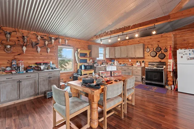 a kitchen with stainless steel appliances granite countertop a stove and a sink