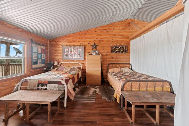 a view of a chairs and table in backyard of the house