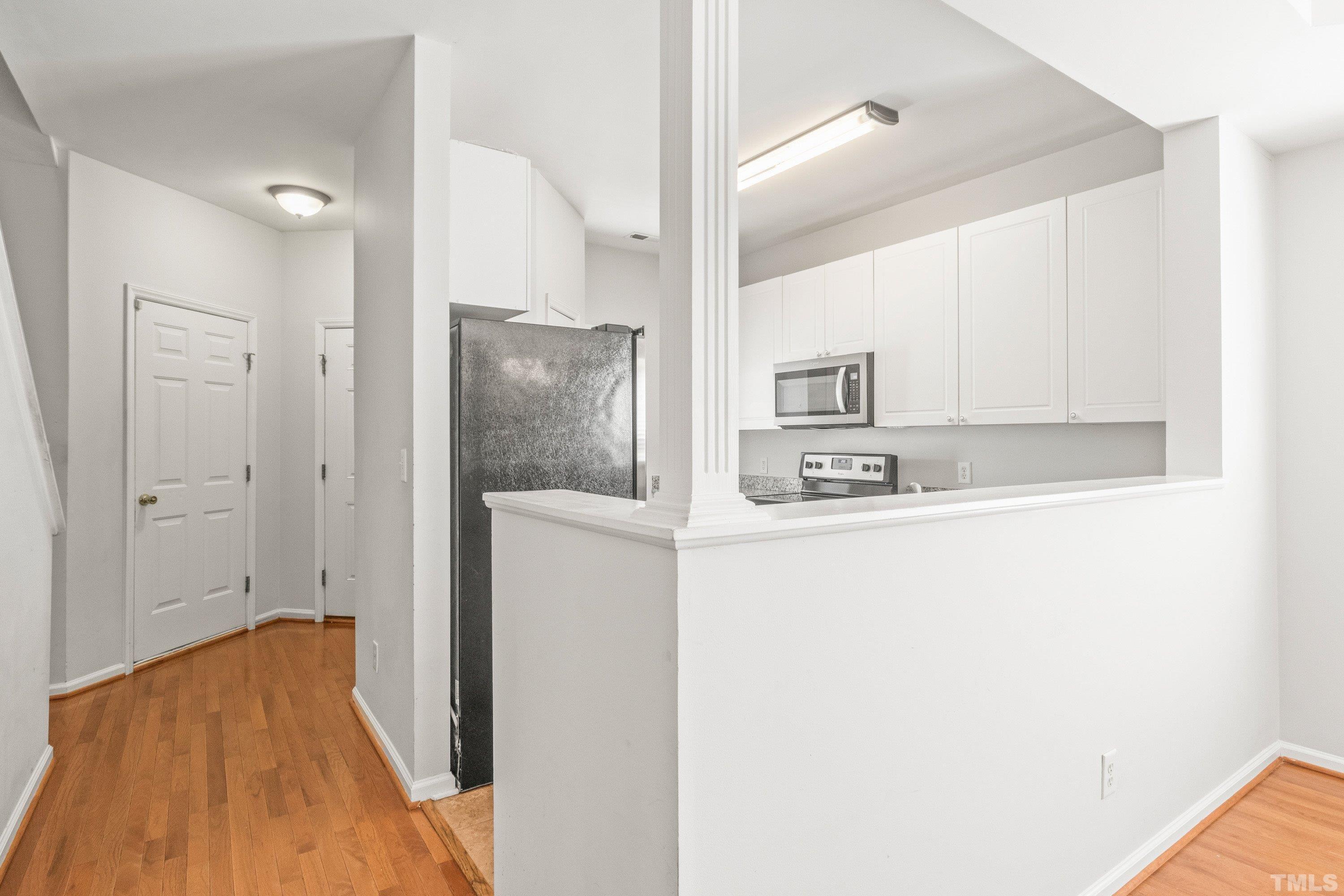 5355 Sahalee Way Raleigh, NC 27604 - Photo 12 of 42 a view of kitchen with stainless steel appliances refrigerator stove and microwave