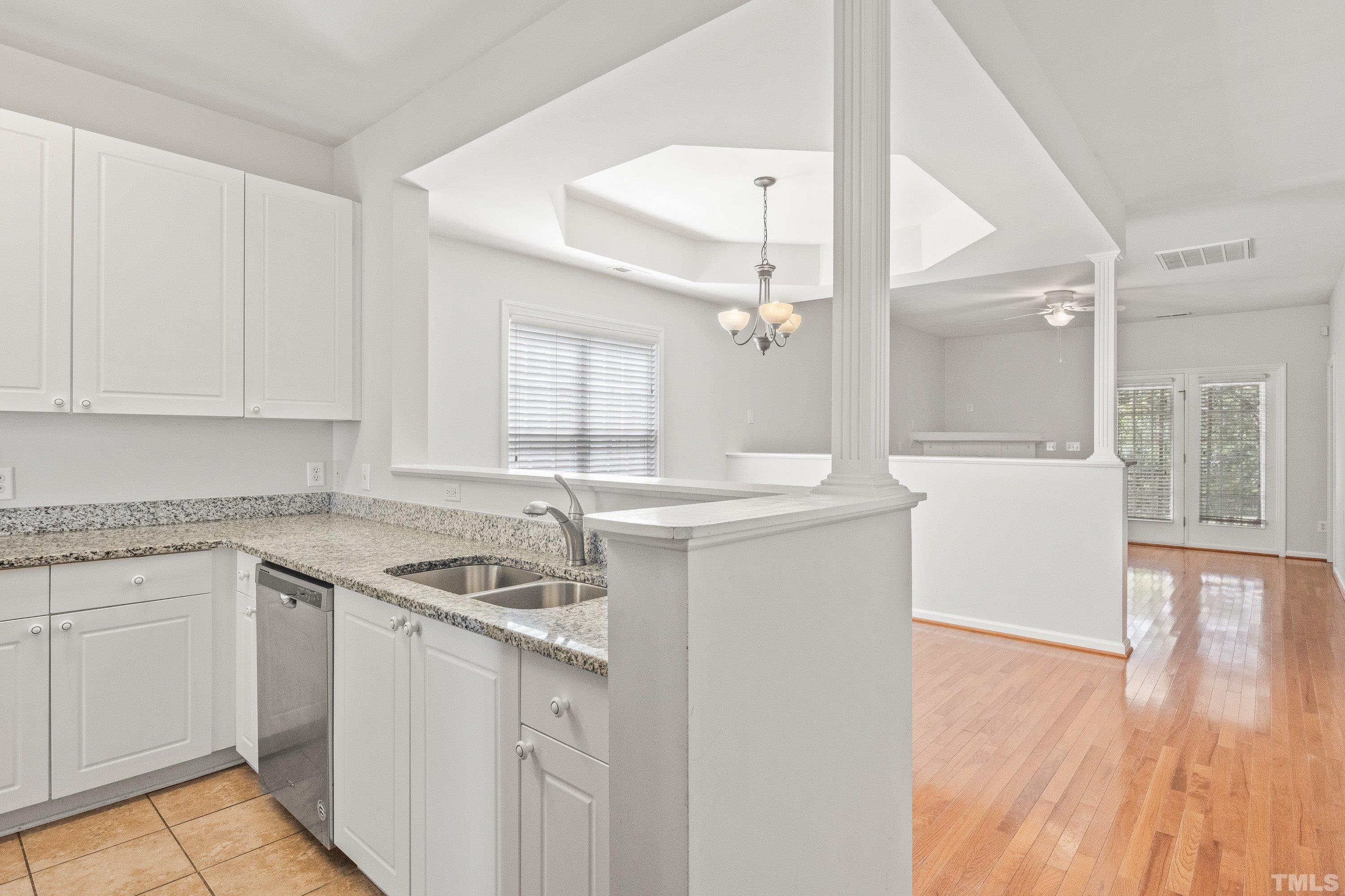 5355 Sahalee Way Raleigh, NC 27604 - Photo 14 of 42 a kitchen that has a sink a stove and cabinets