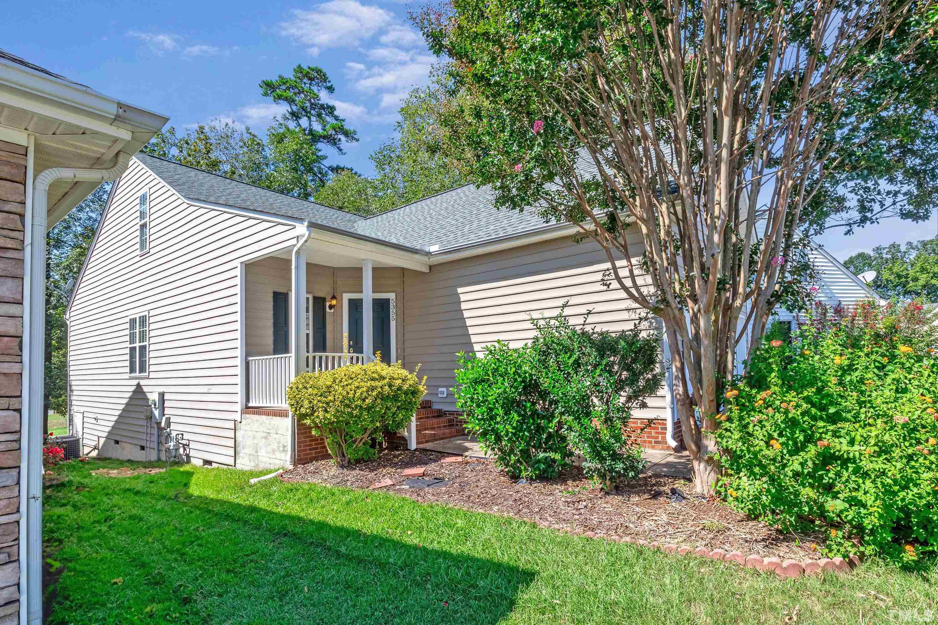 5355 Sahalee Way Raleigh, NC 27604 - Photo 2 of 42 a view of a house with a yard and a garden