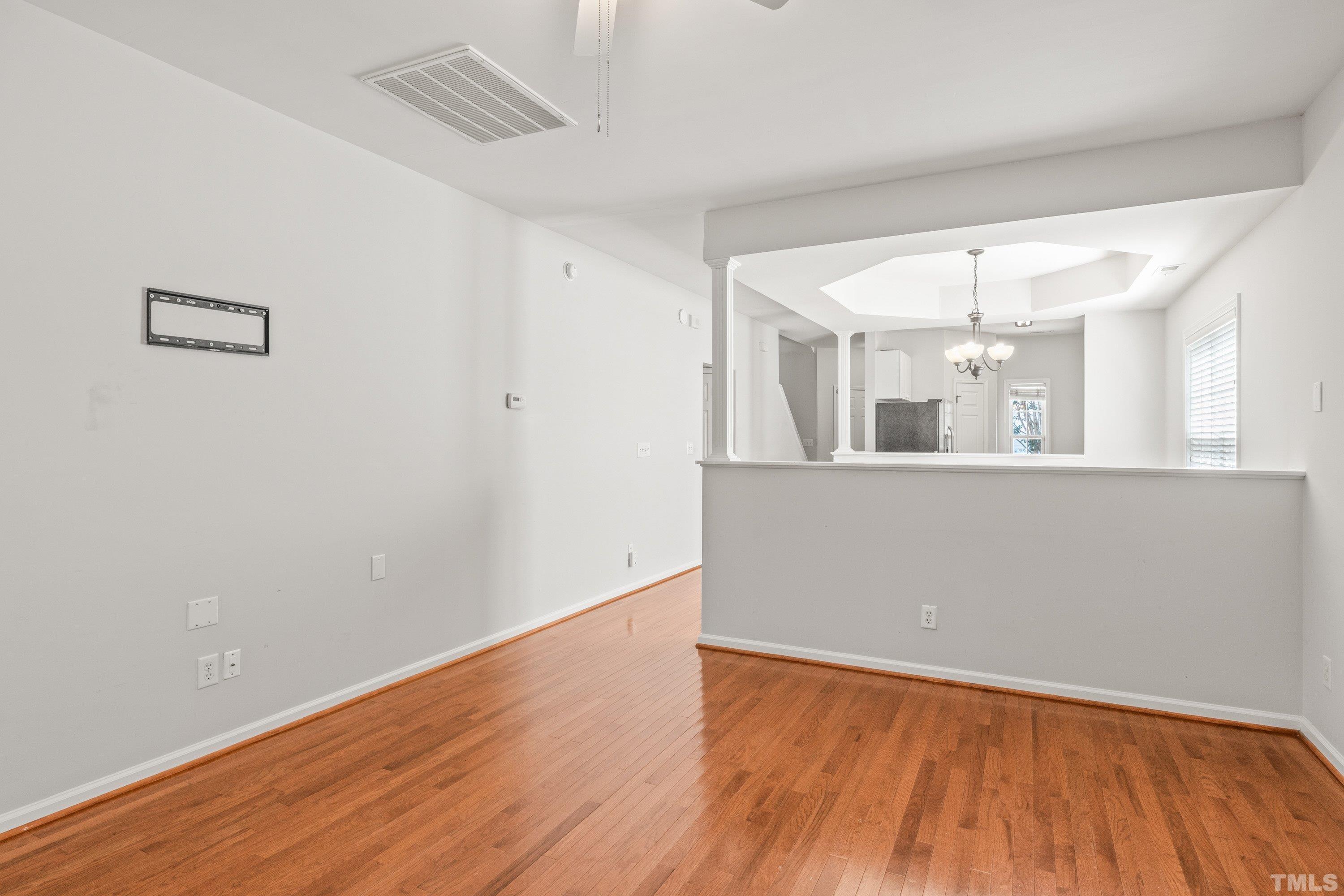 5355 Sahalee Way Raleigh, NC 27604 - Photo 24 of 42 wooden floor in an empty room with a window
