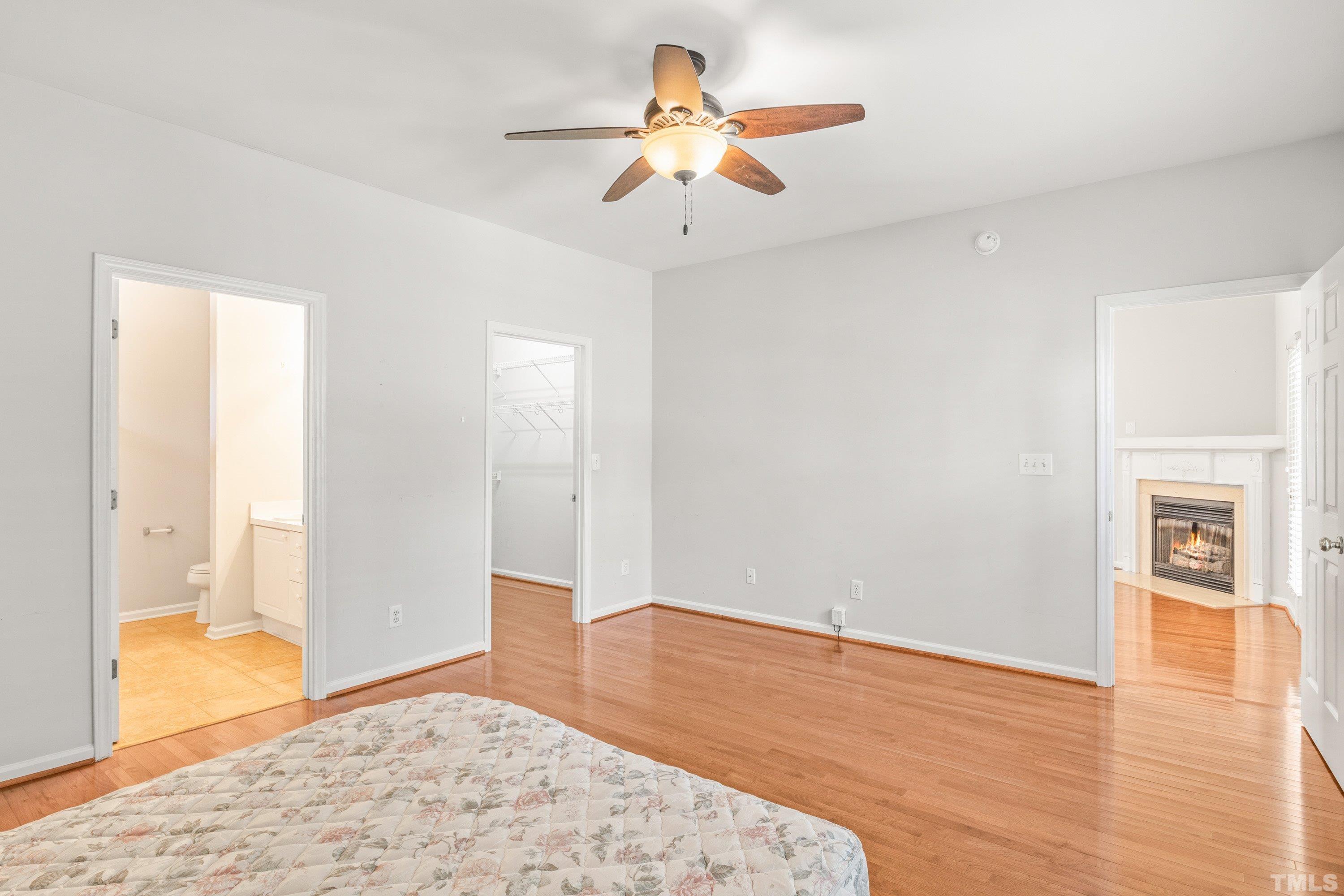 5355 Sahalee Way Raleigh, NC 27604 - Photo 28 of 42 a view of a livingroom with wooden floor and a ceiling fan