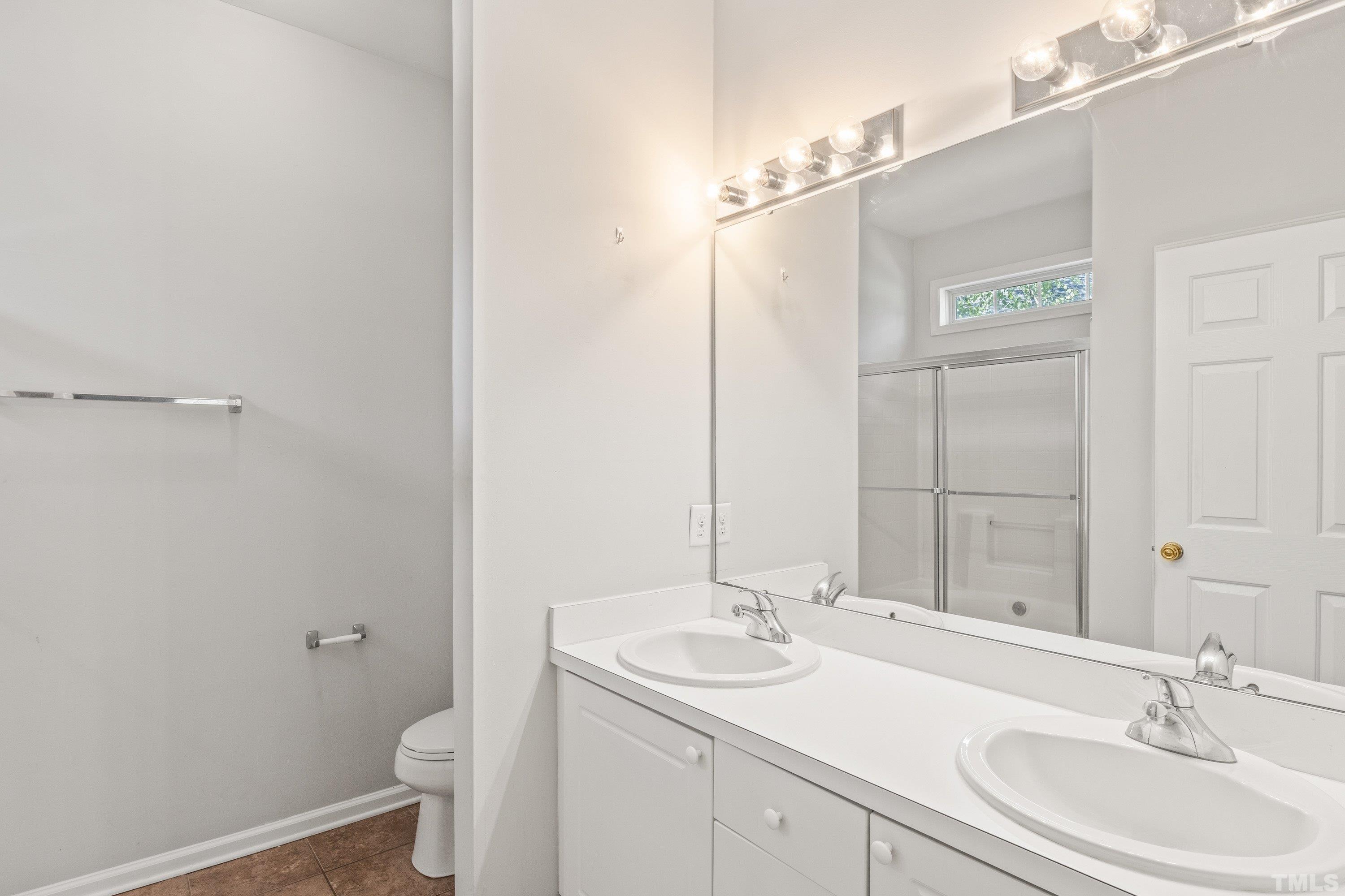 5355 Sahalee Way Raleigh, NC 27604 - Photo 30 of 42 a bathroom with a sink and a mirror with toilet