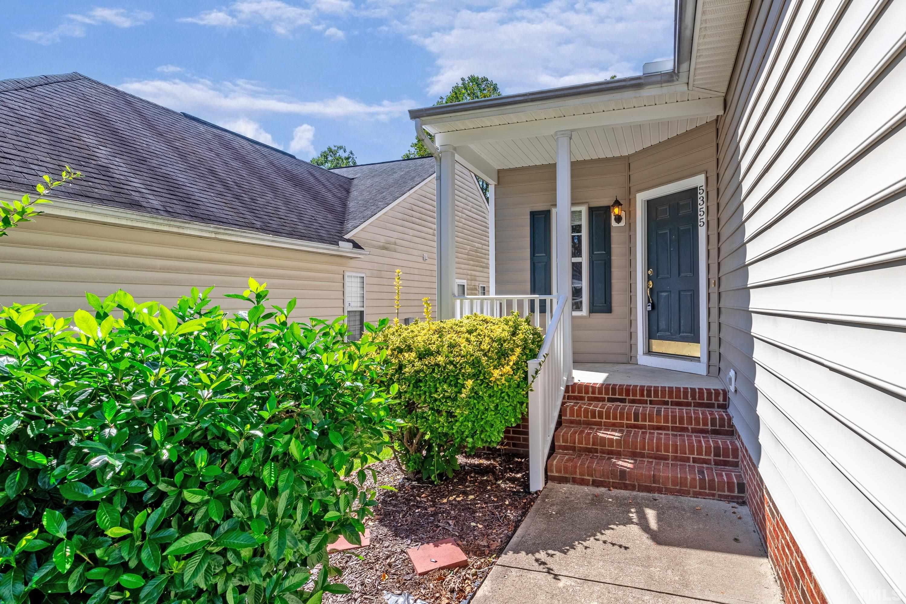 5355 Sahalee Way Raleigh, NC 27604 - Photo 3 of 42 a front view of a house with a yard