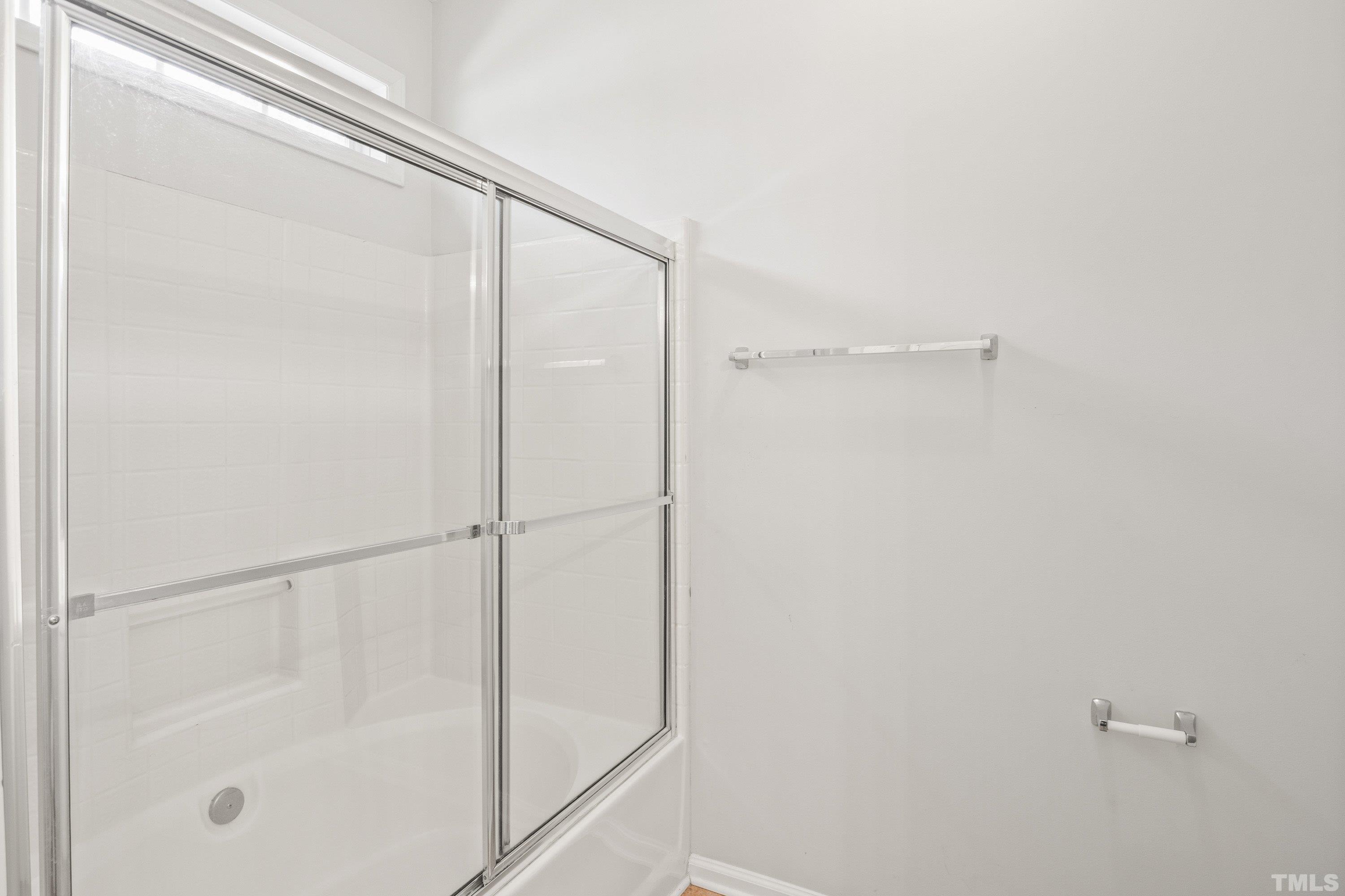 5355 Sahalee Way Raleigh, NC 27604 - Photo 31 of 42 a bathroom with a glass shower door
