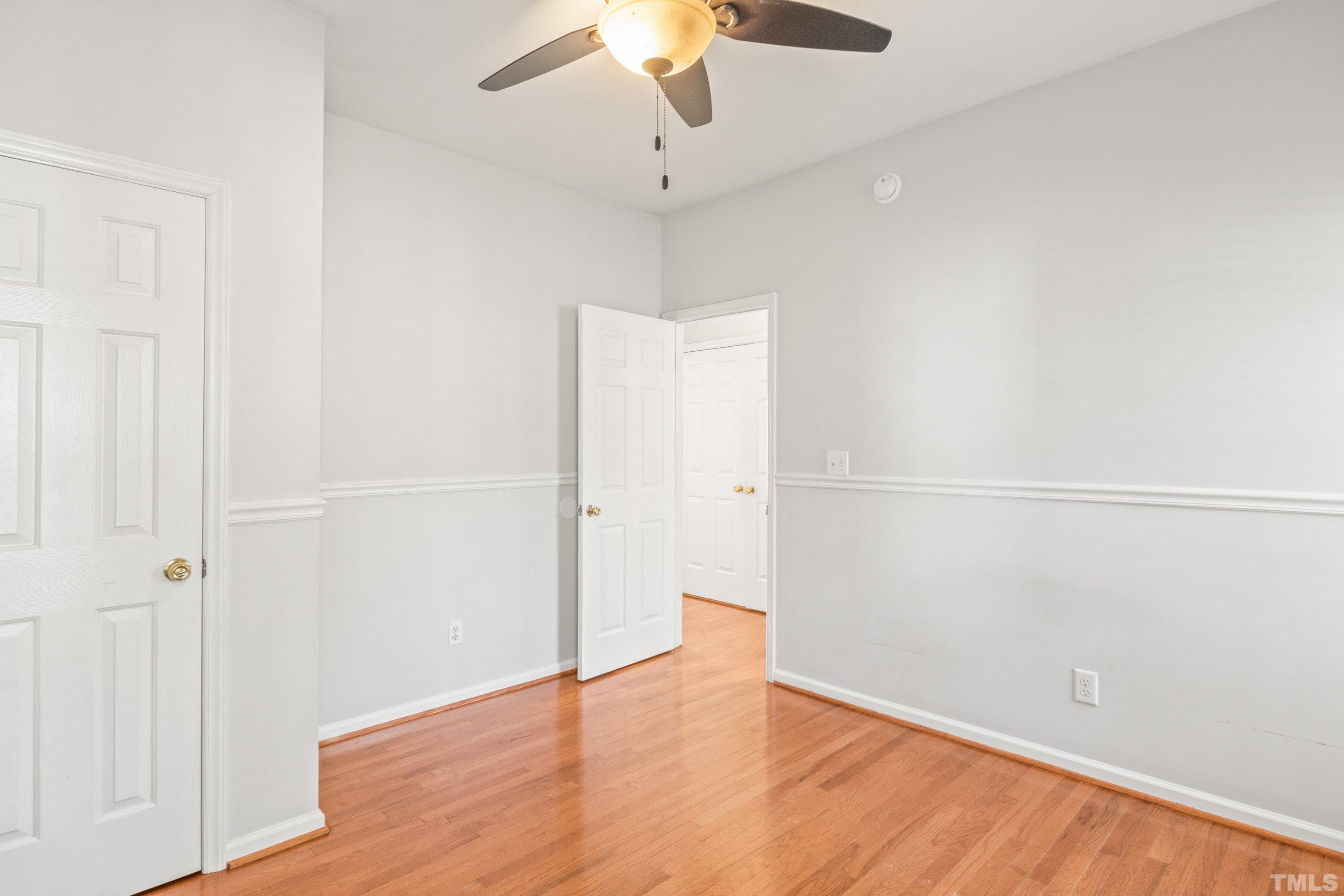 5355 Sahalee Way Raleigh, NC 27604 - Photo 34 of 42 a view of an empty room with wooden floor