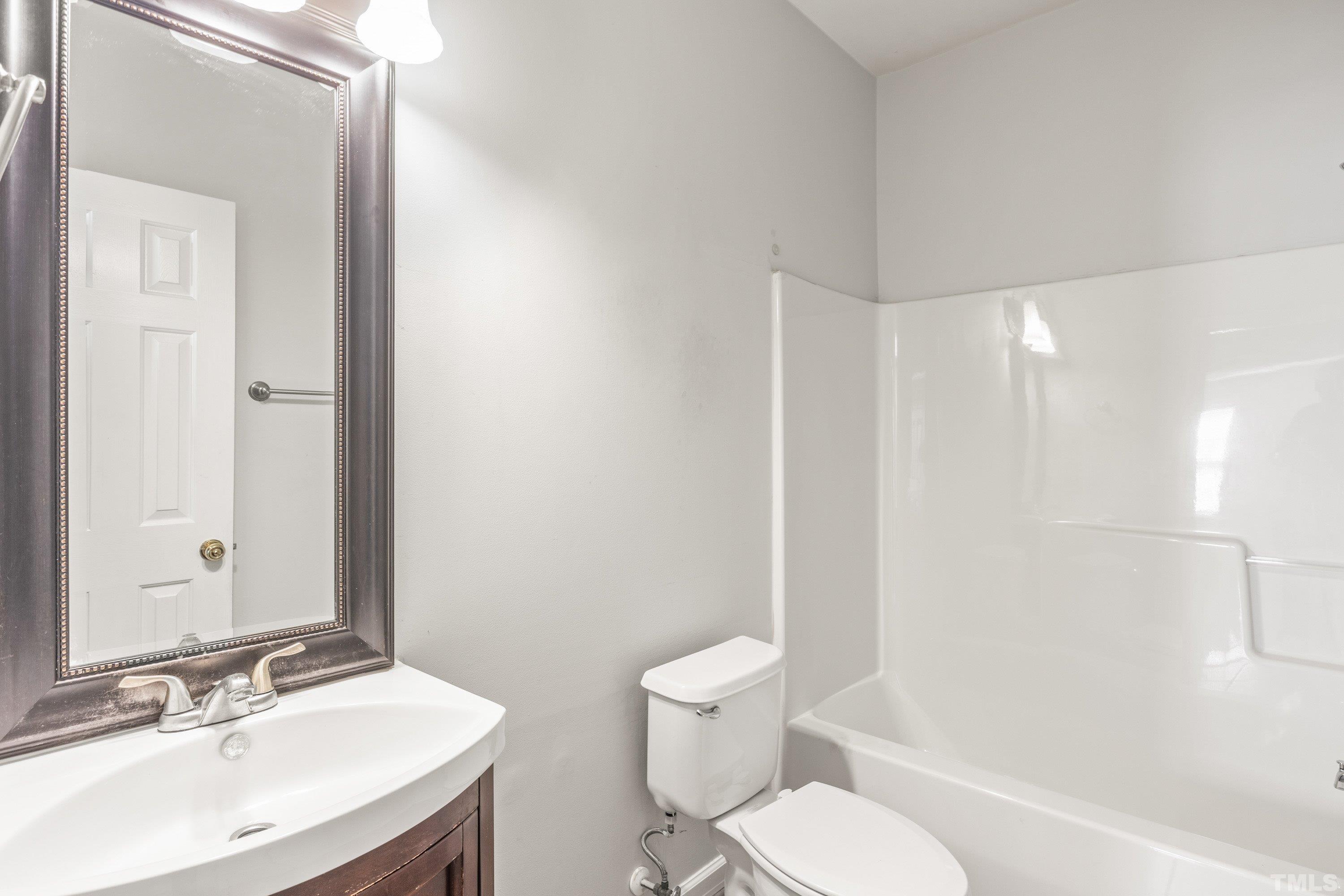 5355 Sahalee Way Raleigh, NC 27604 - Photo 35 of 42 a bathroom with a sink toilet and shower