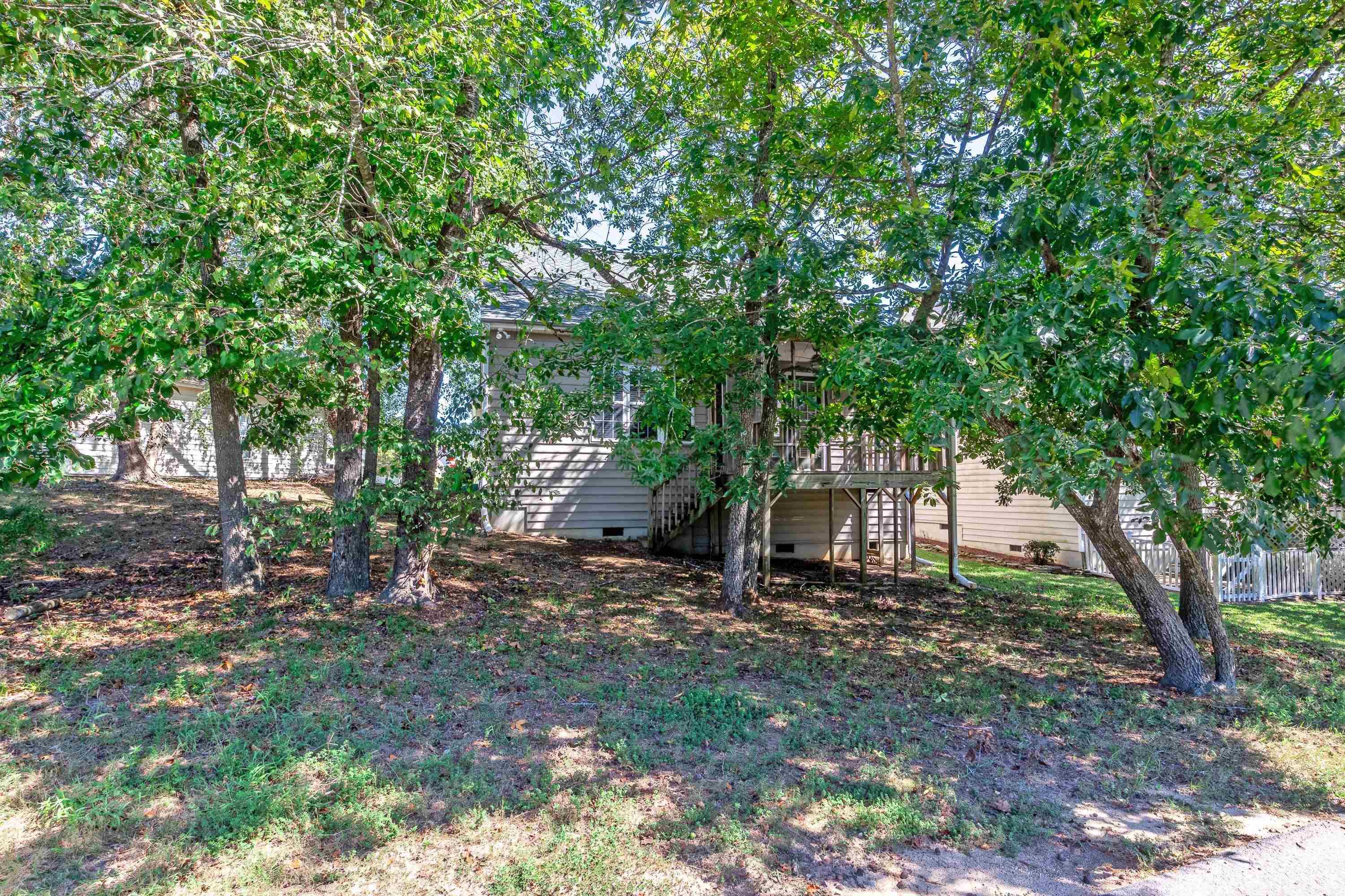 5355 Sahalee Way Raleigh, NC 27604 - Photo 6 of 42 a view of a tree in front of a house