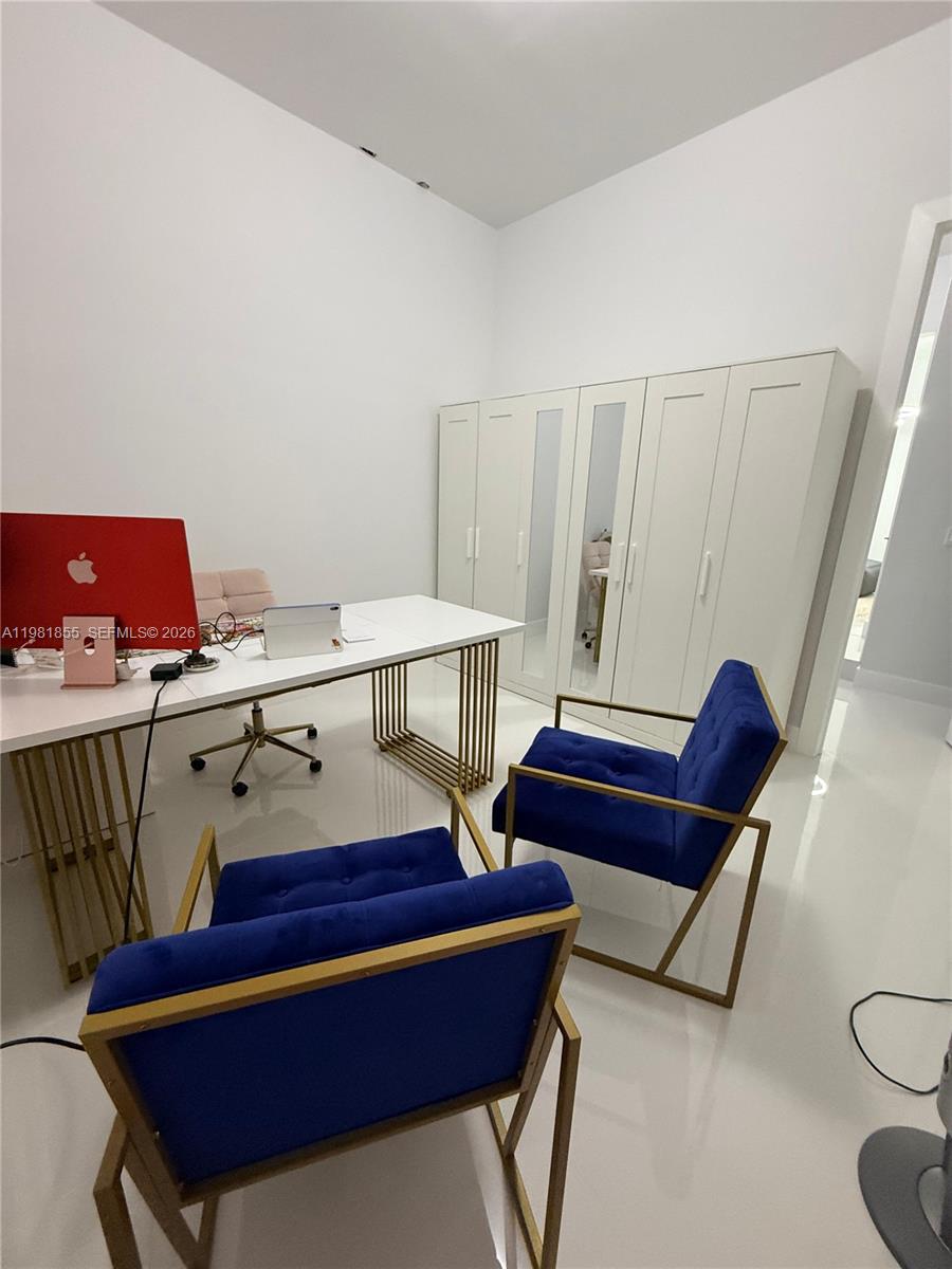 15455 Southwest 232nd Street, Unit A Miami, FL 33170 - Photo 7 of 12 a view of a workspace with furniture
