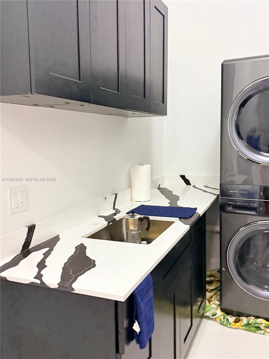 15455 Southwest 232nd Street, Unit A Miami, FL 33170 - Photo 9 of 12 a kitchen with a sink a stove and a microwave