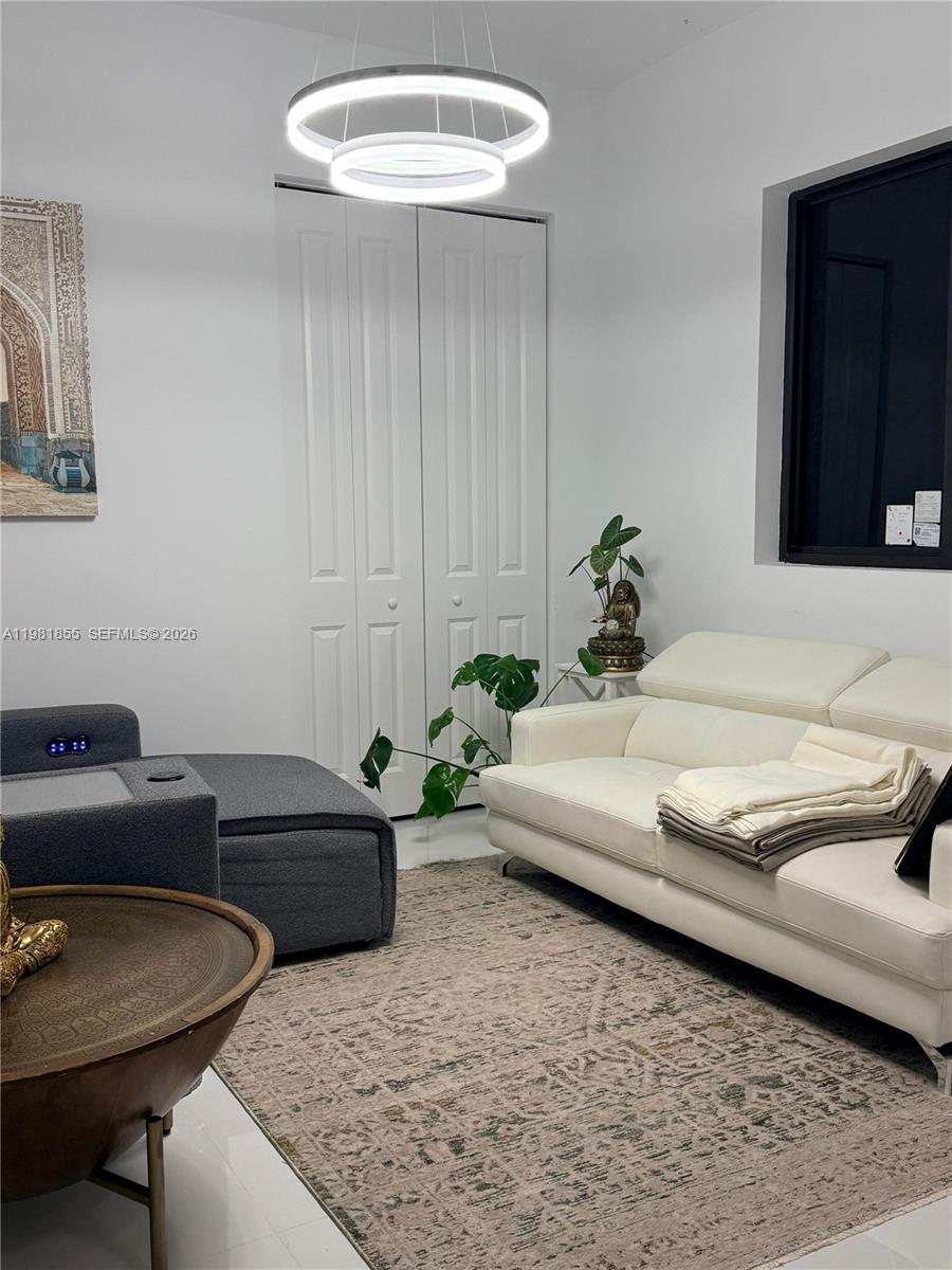 15455 Southwest 232nd Street, Unit A Miami, FL 33170 - Photo 10 of 12 a living room with furniture