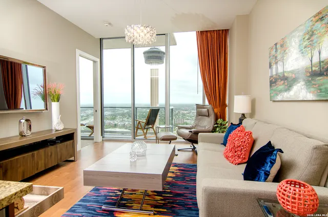 a living room with furniture and a large window