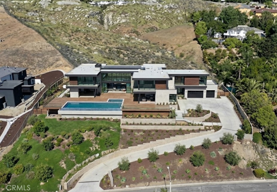 7390 Corinthian Way Riverside, CA 92506 - Photo 2 of 38 an aerial view of a house with garden