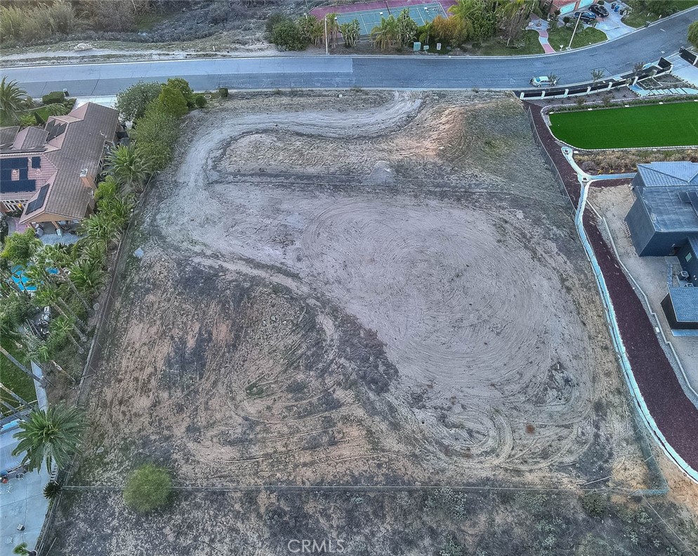 7390 Corinthian Way Riverside, CA 92506 - Photo 28 of 38 a view of a dry yard with wooden fence